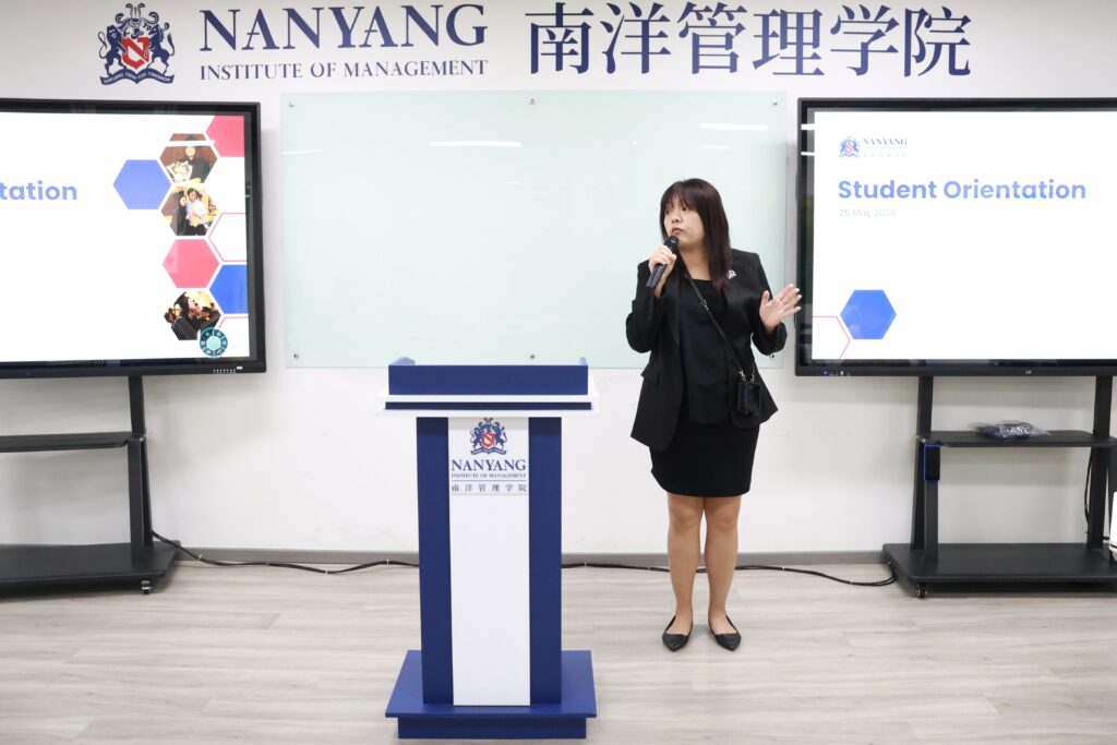 Dean for School of Engineering and the School of Arts, Science & Technology, and Director of the Career Service Centre, Ms. Thong, hyping up the students and providing information to settle better on campus.