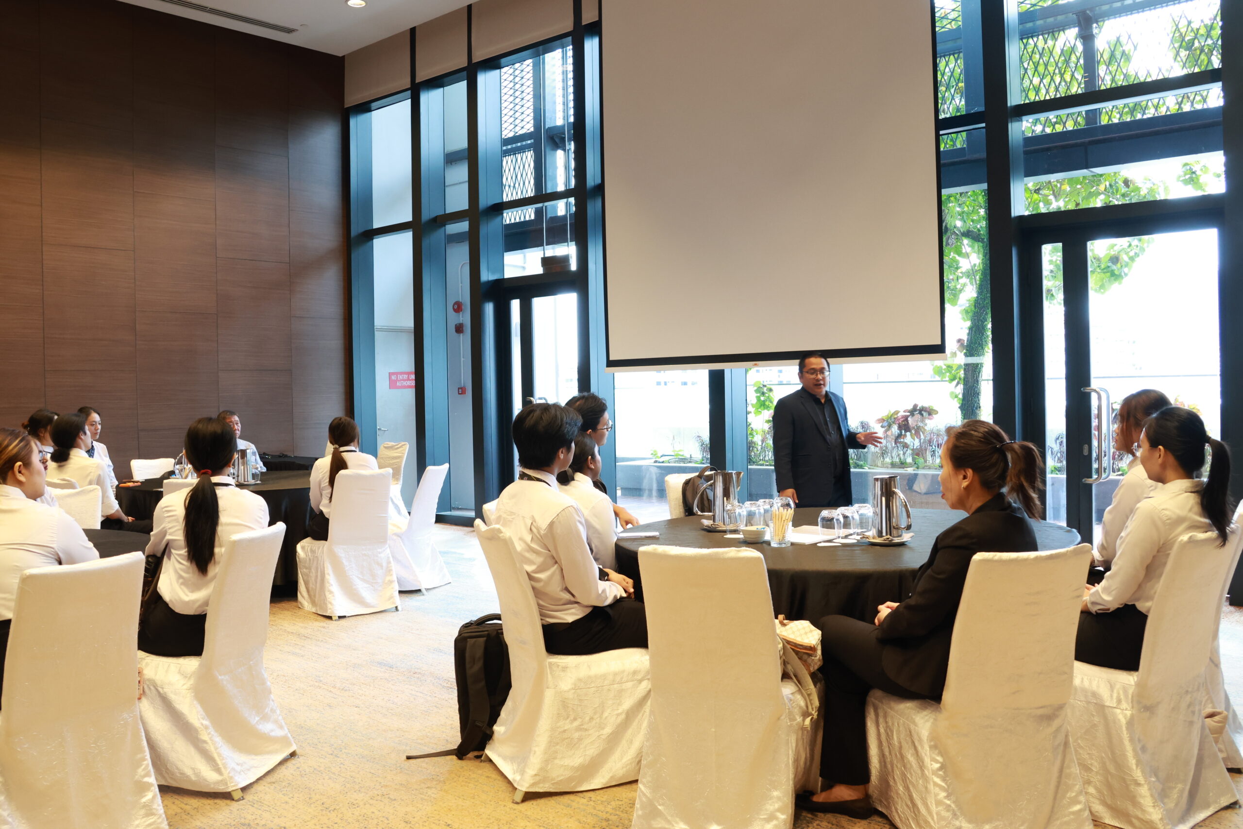 Mr Fariz Hakim, Front Office and Sustainability Manager presenting for the students of Nanyang Institute of Management