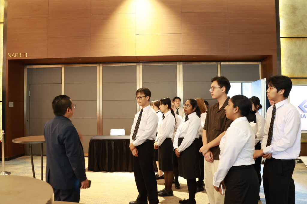 NIM students carefully listening to the briefing while on hotel tour