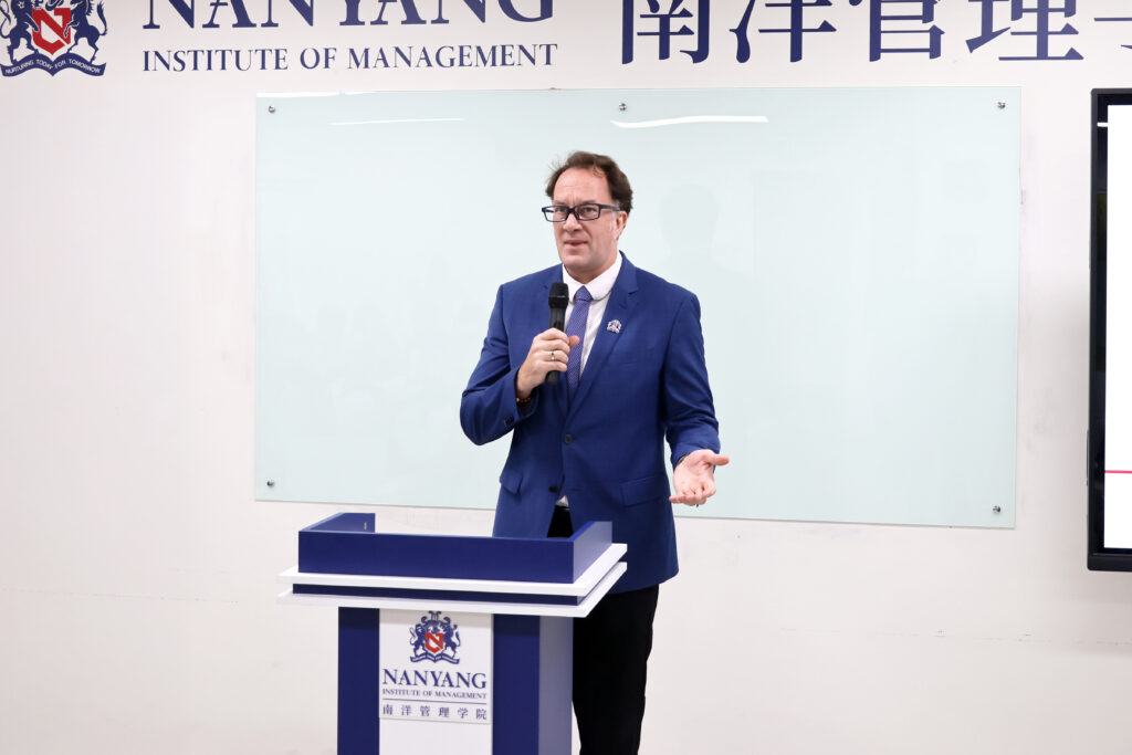 Nanyang Institute of Management (NIM) Vice President, Mr. Craig Albrightson,m warmly welcoming students