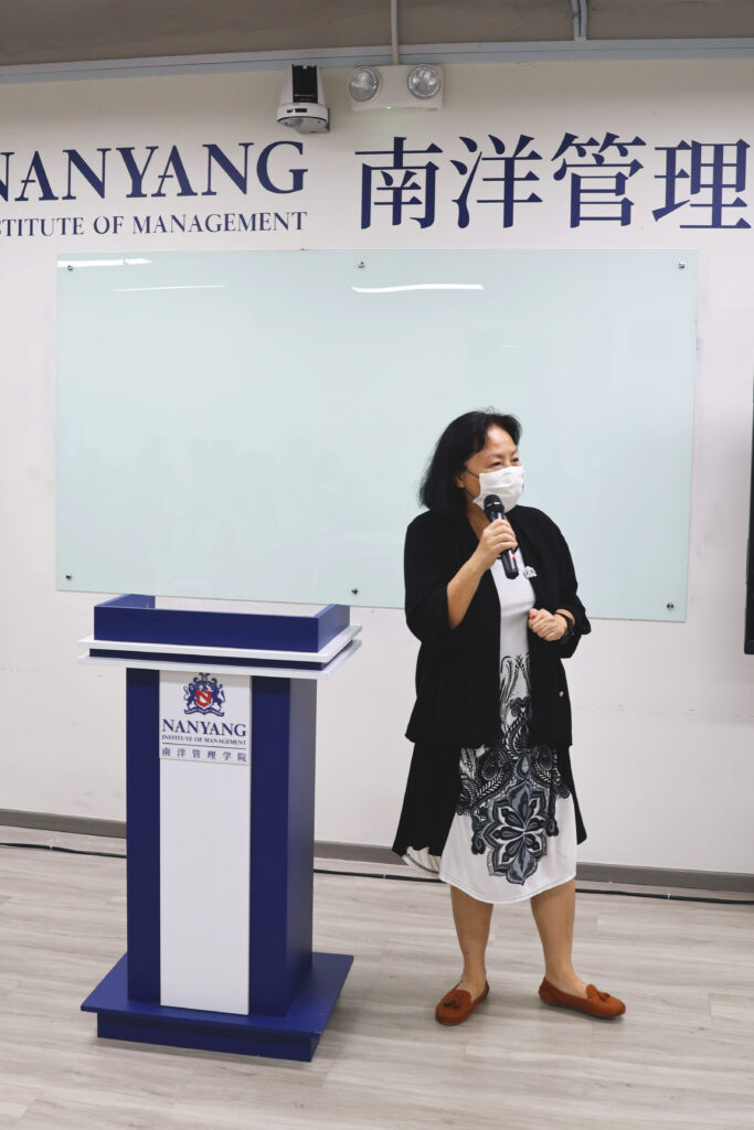 Ms. Fanny, Dean of Education, briefing students
