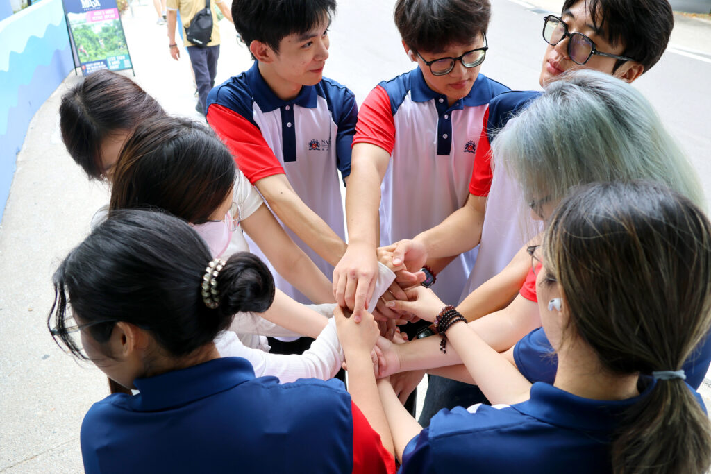 New Students playing tug o war at Sentosa Beach